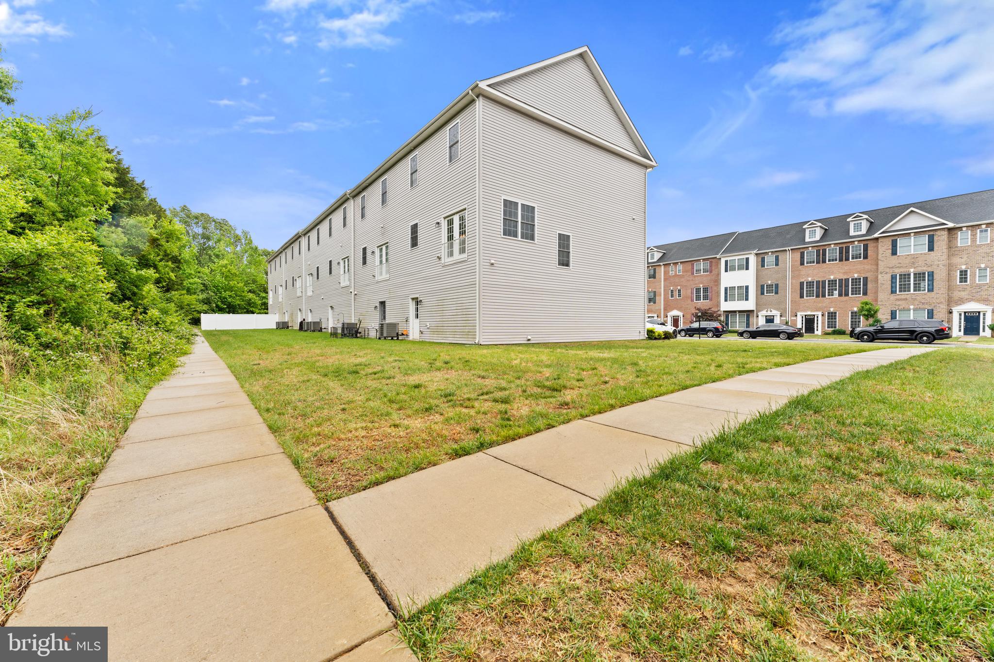 982 Rye Drive La Plata, MD 20646 - Photo 38 of 42 Sidewalk and green space beside homes