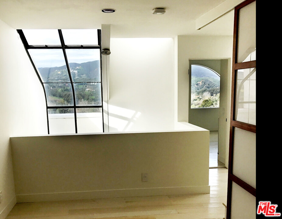 a view of a living room with a large window