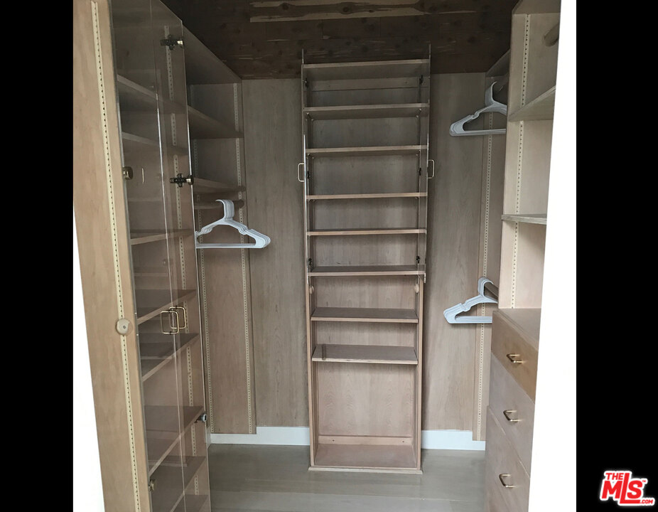 29221 Heathercliff Road, Unit 12 Malibu, CA 90265 - Photo 5 of 8 a view of walk in closet with empty racks
