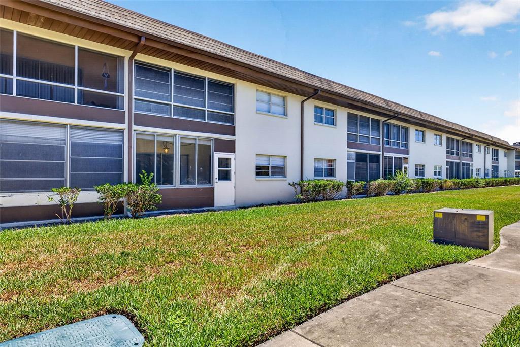 5197 Silent Loop, Unit 124 New Port Richey, FL 34652 - Photo 37 of 55 a view of house with a yard