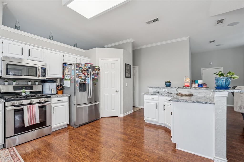 8016 Stern Street Frisco, TX 75035 - Photo 8 of 20 Large pantry and breakfast bar in kitchen.