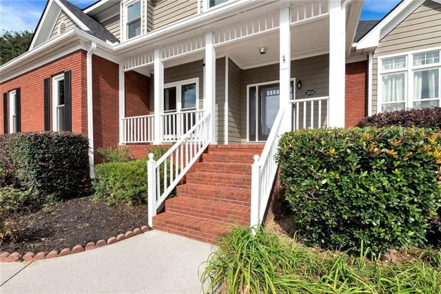 a view of entryway with wooden floor and stairs