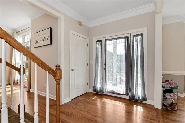 a view of a workspace with furniture window and wooden floor