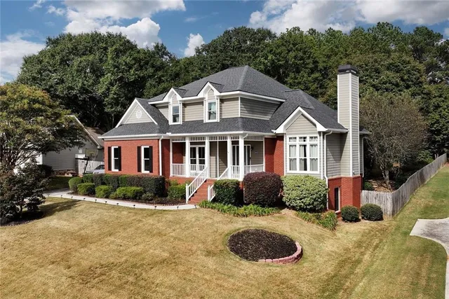 a front view of a house with yard