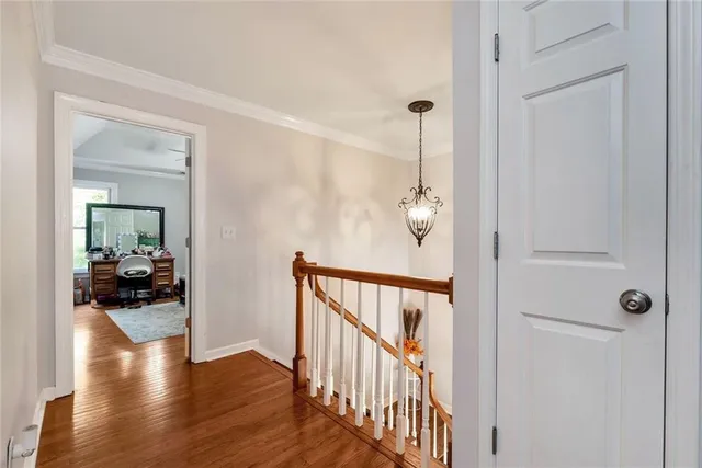 a bathroom with a sink a toilet a mirror and shower
