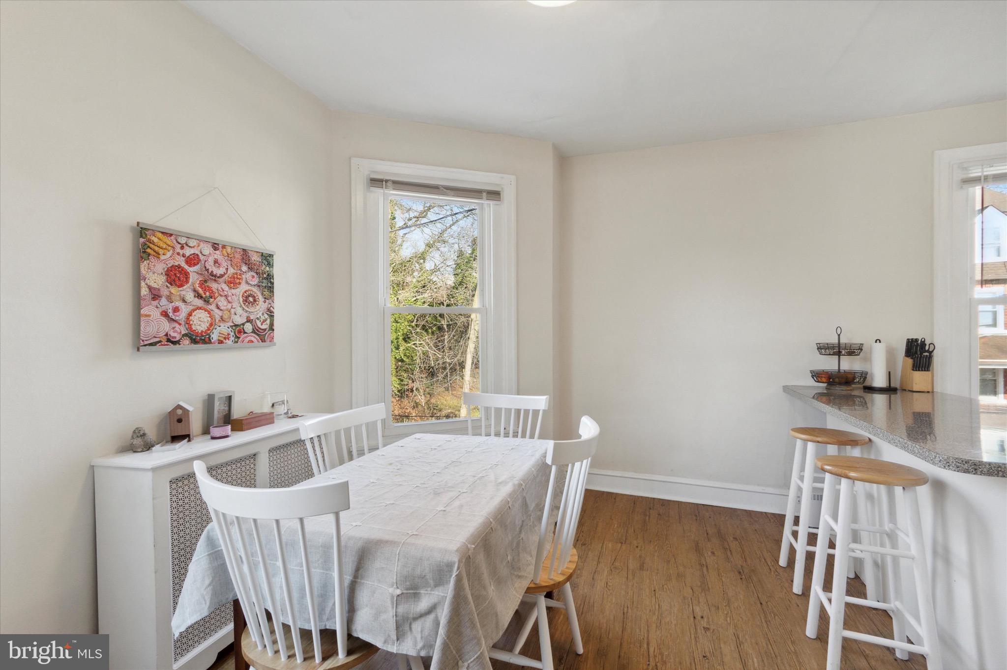 118 Walnut Avenue, Unit 2 Ardmore, PA 19003 - Photo 10 of 15 a dining room with furniture and wooden floor