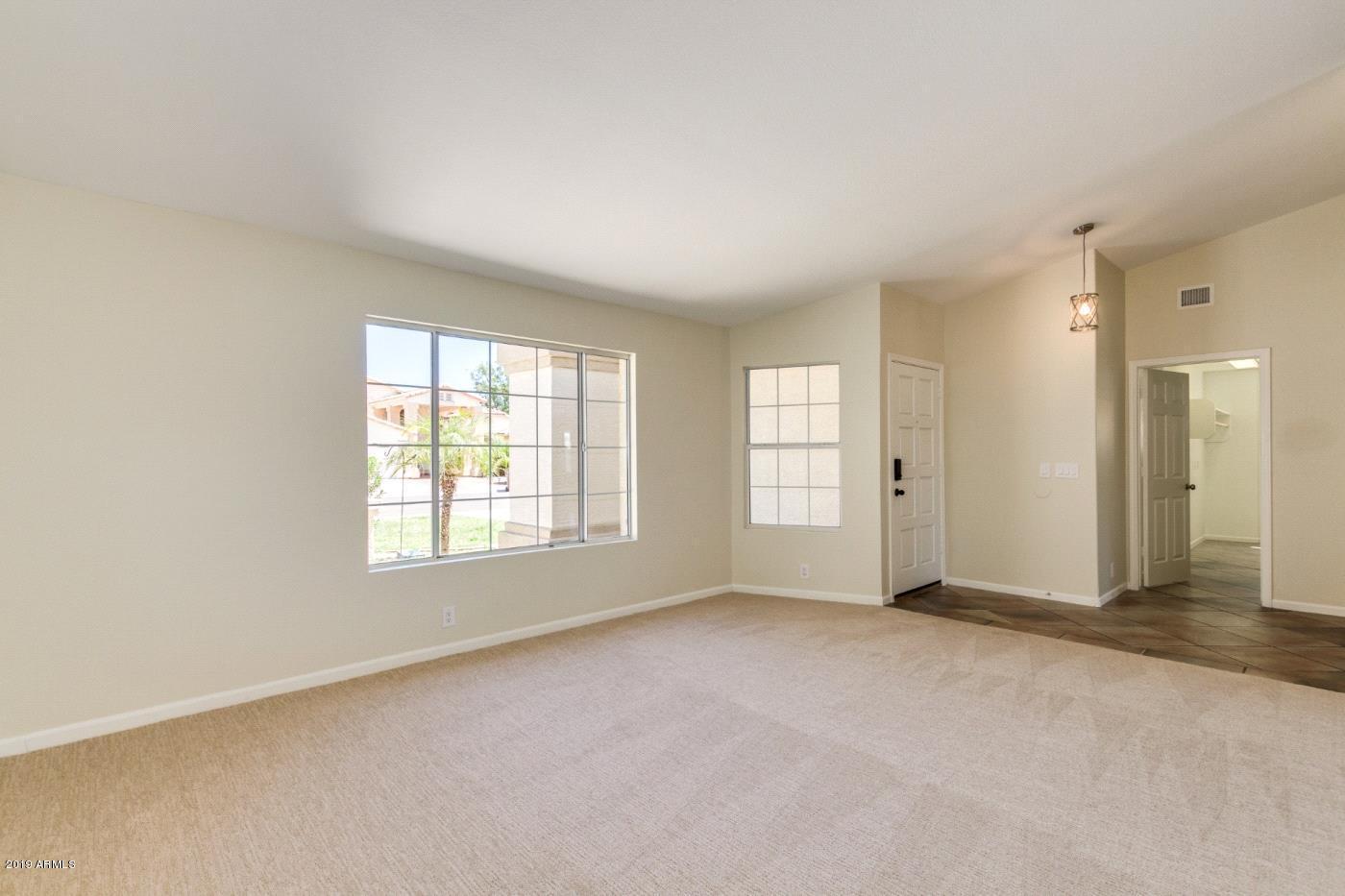 8757 West Wethersfield Road Peoria, AZ 85381 - Photo 4 of 18 4. d.Living room