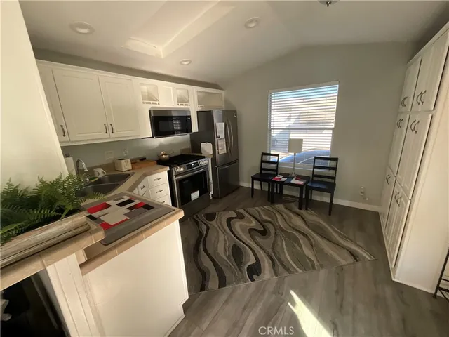 a view of a kitchen with workspace and a window