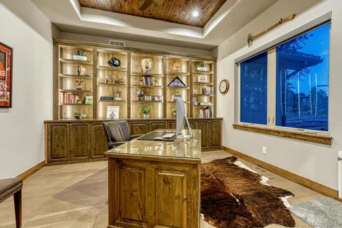 a kitchen with stainless steel appliances kitchen island granite countertop a sink and cabinets