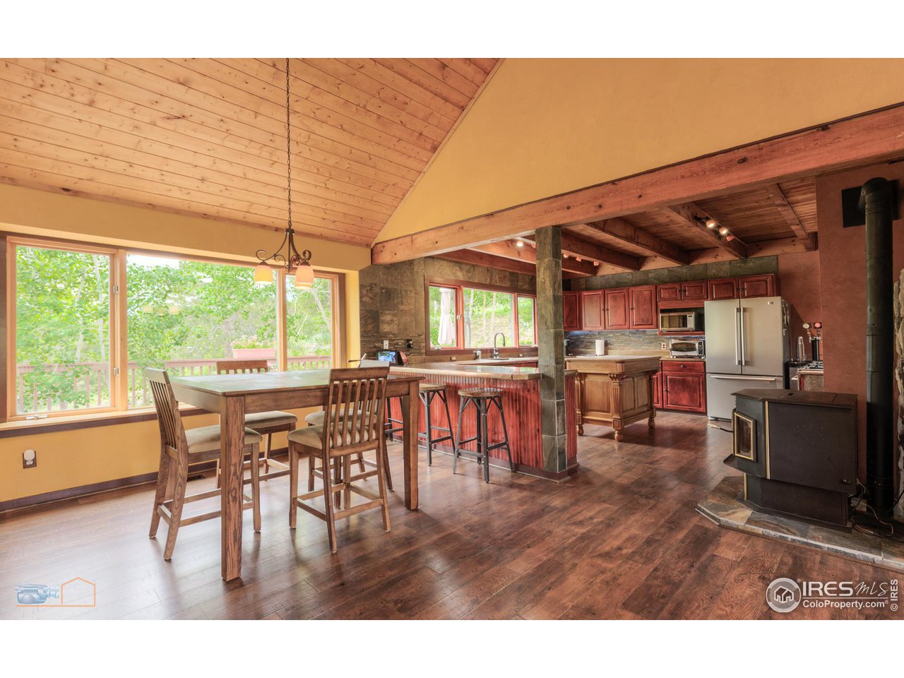 111 Puma Drive Boulder, CO 80302 - Photo 13 of 37 a dining room with furniture and a floor to ceiling window