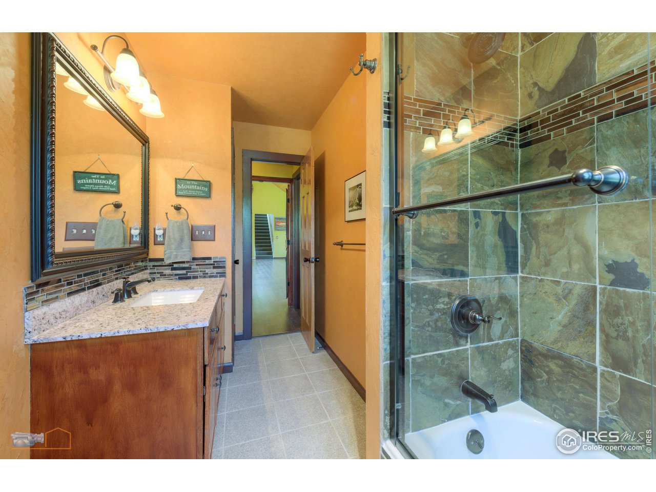 111 Puma Drive Boulder, CO 80302 - Photo 16 of 37 a bathroom with a granite countertop sink a mirror and shower