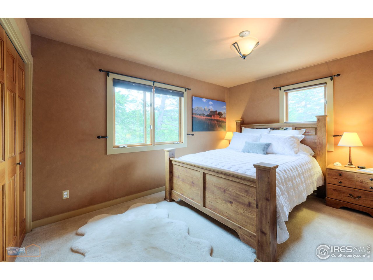 111 Puma Drive Boulder, CO 80302 - Photo 17 of 37 a bedroom with a bed and window