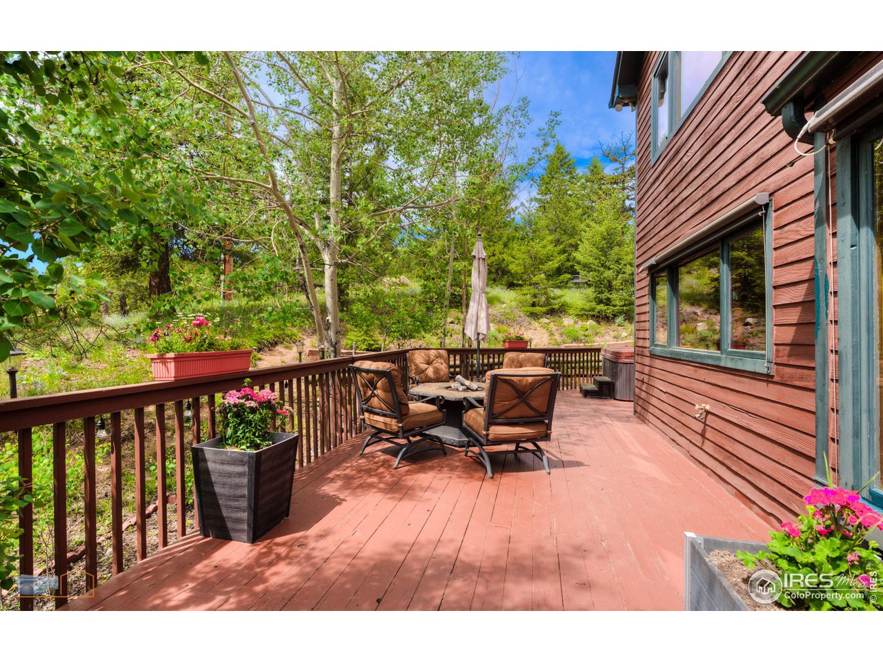 111 Puma Drive Boulder, CO 80302 - Photo 26 of 37 a view of a patio with table and chairs and potted plants