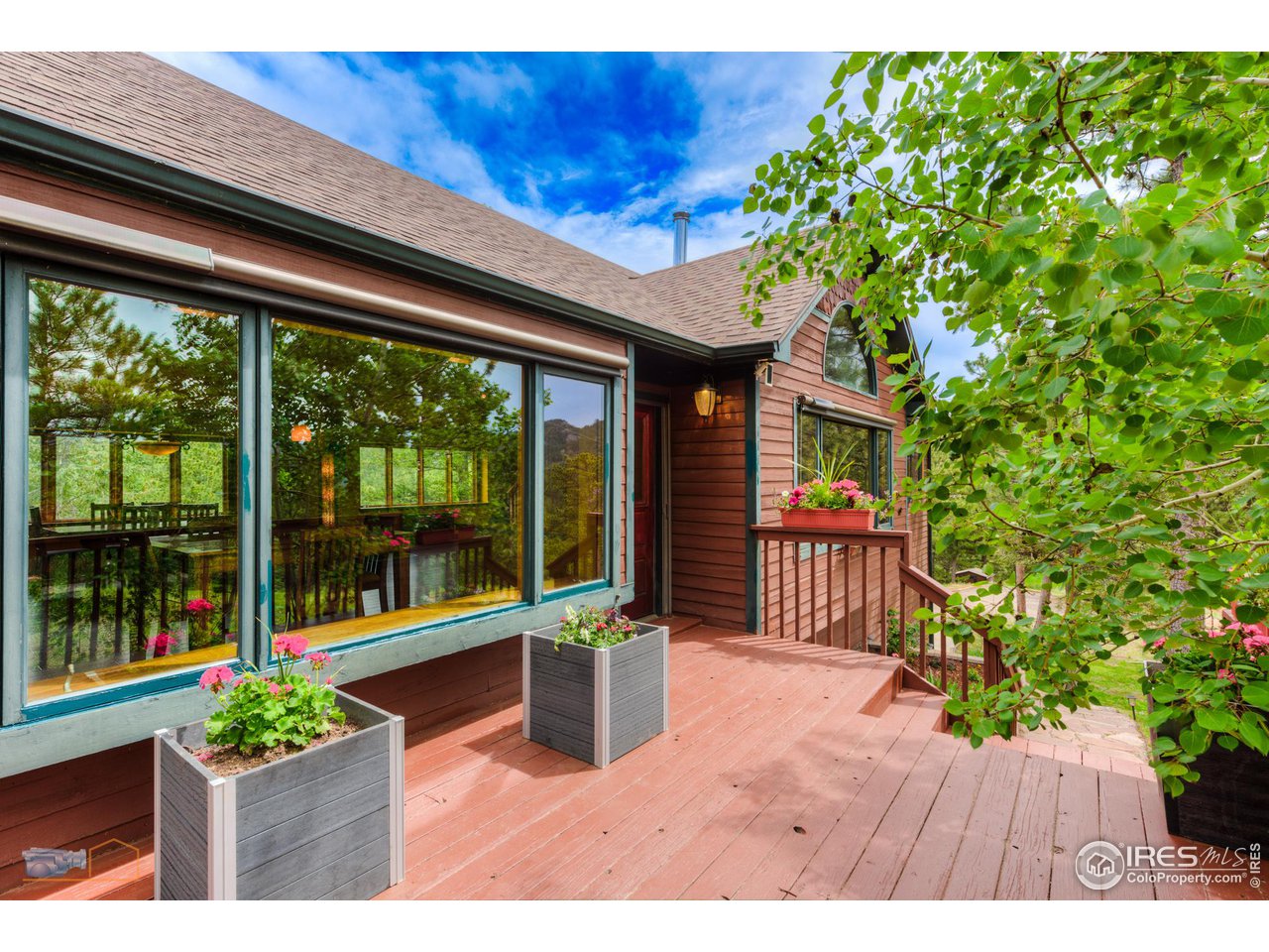 111 Puma Drive Boulder, CO 80302 - Photo 27 of 37 a porch with a bench in front of balcony