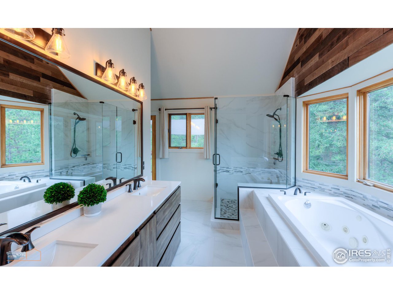 111 Puma Drive Boulder, CO 80302 - Photo 5 of 37 a bathroom with a tub sink and mirror