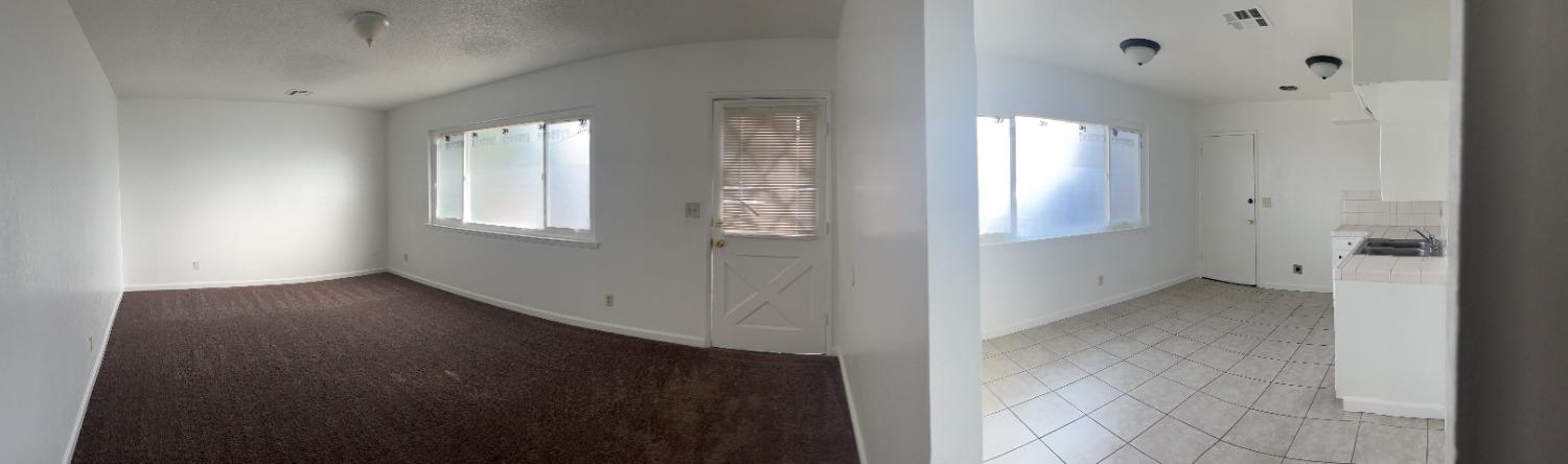 1097 Jefferson Avenue Clovis, CA 93612 - Photo 4 of 11 an empty room with windows