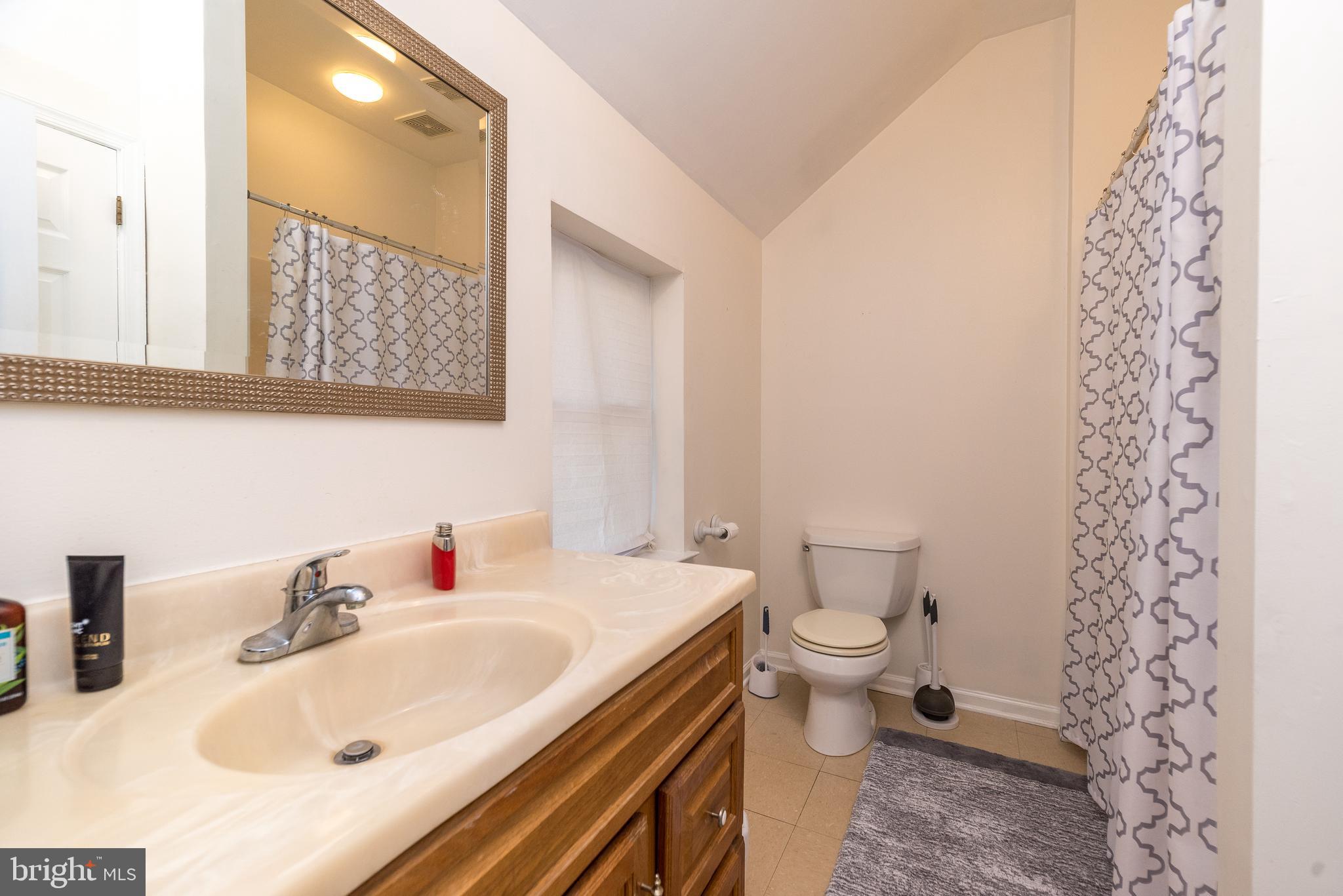205 South 7th Street Perkasie, PA 18944 - Photo 12 of 24 a bathroom with a sink and a toilet