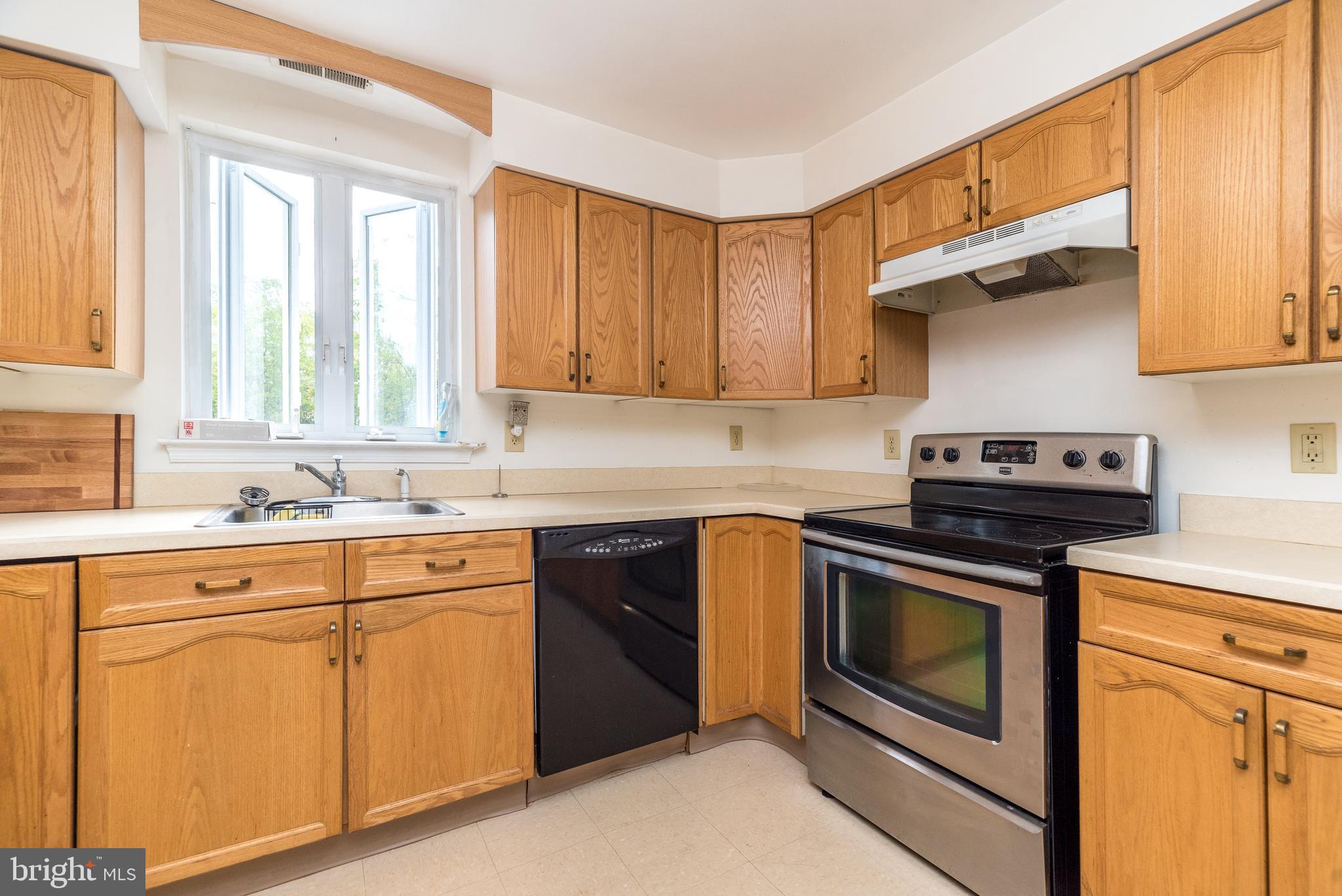 205 South 7th Street Perkasie, PA 18944 - Photo 2 of 24 a kitchen with cabinets appliances and a sink