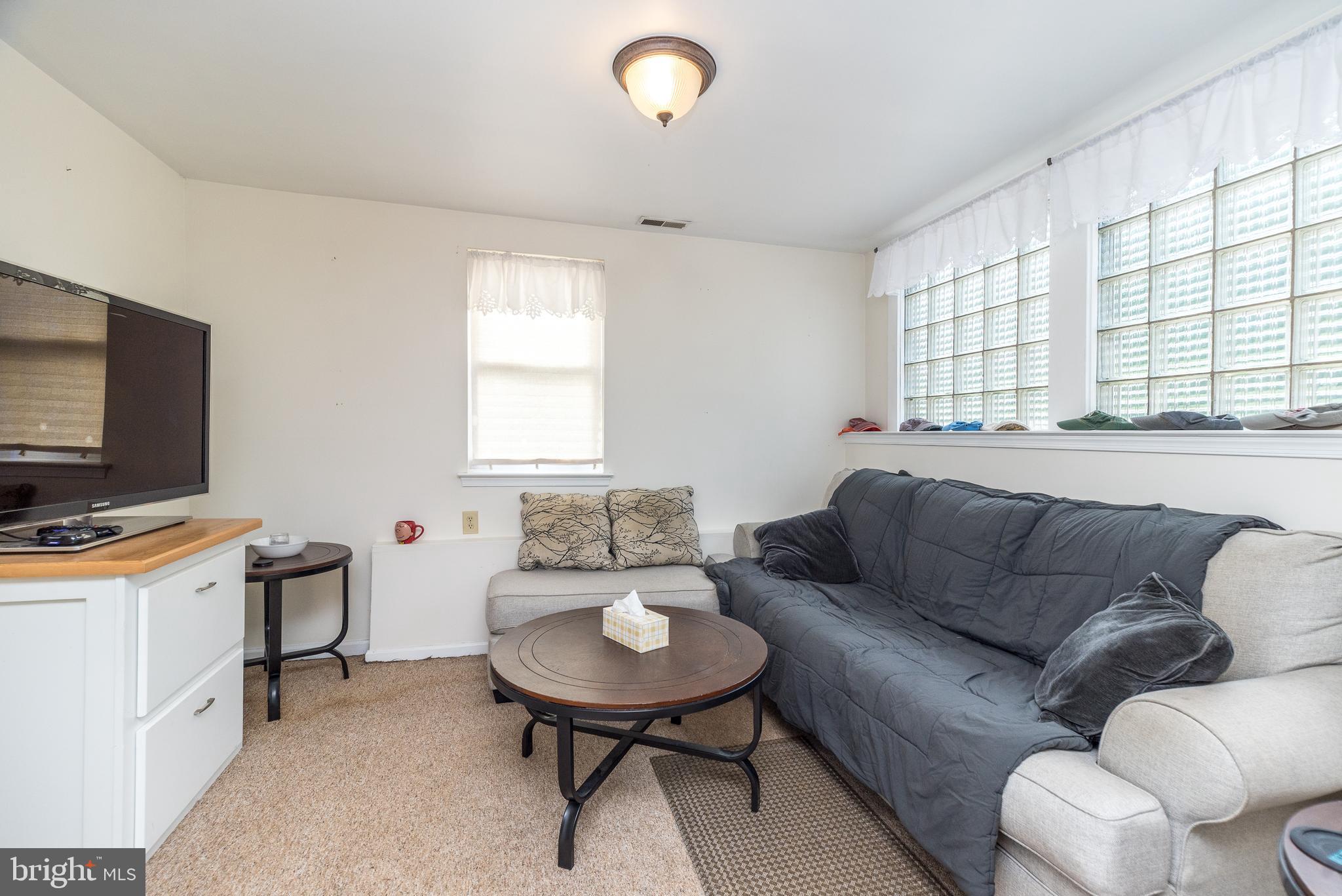 205 South 7th Street Perkasie, PA 18944 - Photo 5 of 24 a living room with furniture and a flat screen tv