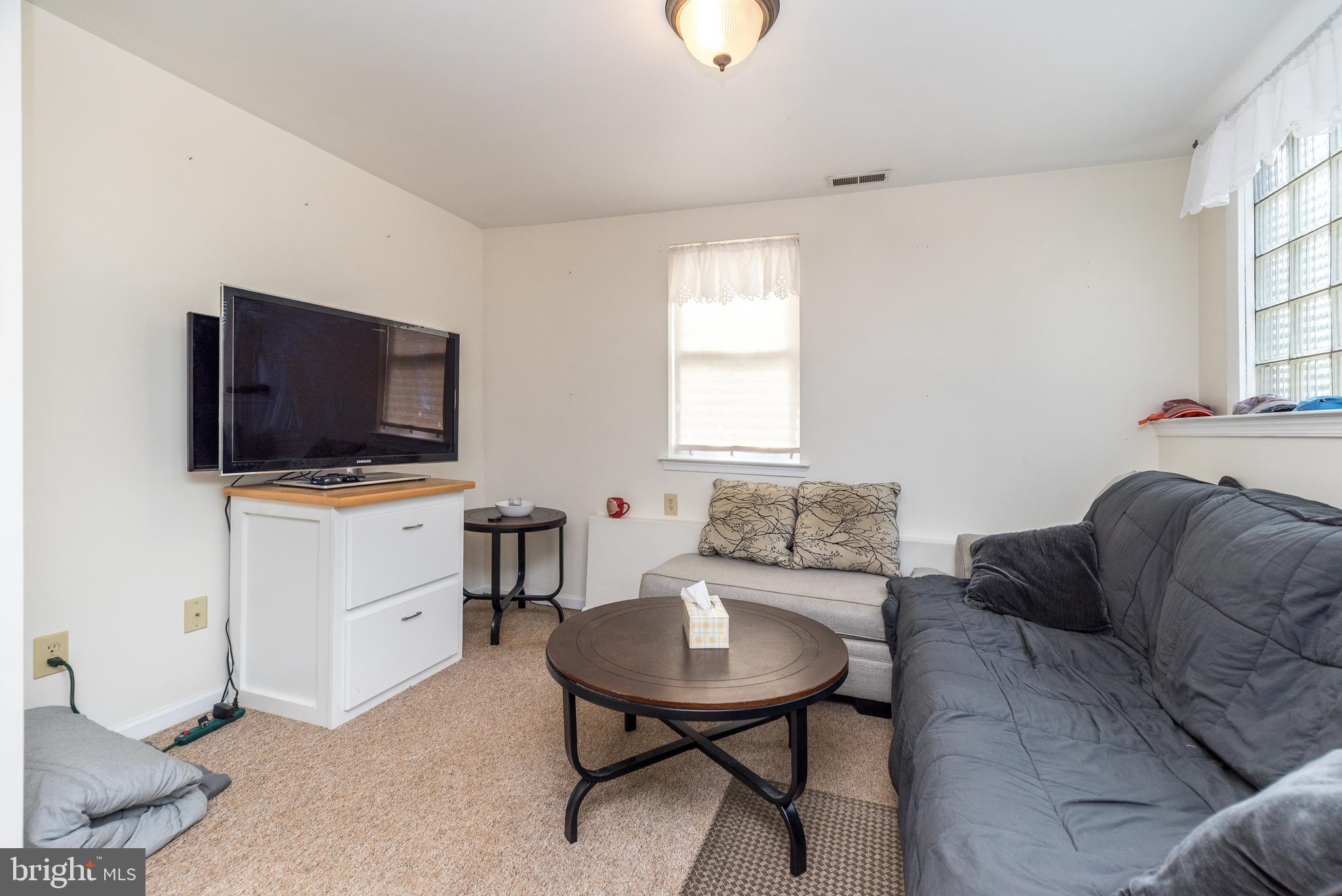 205 South 7th Street Perkasie, PA 18944 - Photo 6 of 24 a living room with furniture and a flat screen tv