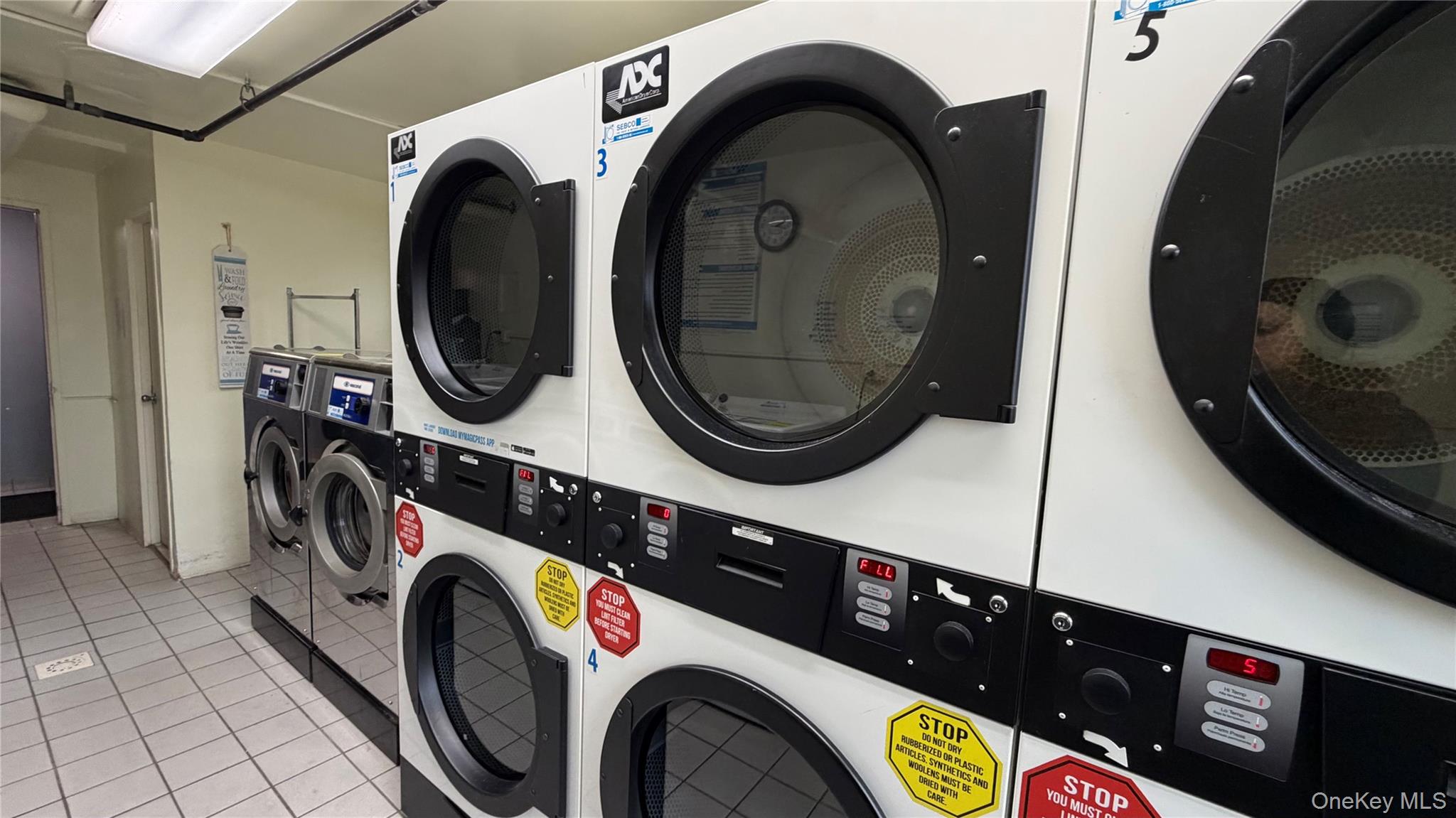 151-05 Cross Island Parkway, Unit 3E Queens, NY 11357 - Photo 21 of 29 a utility room with dryer and washer