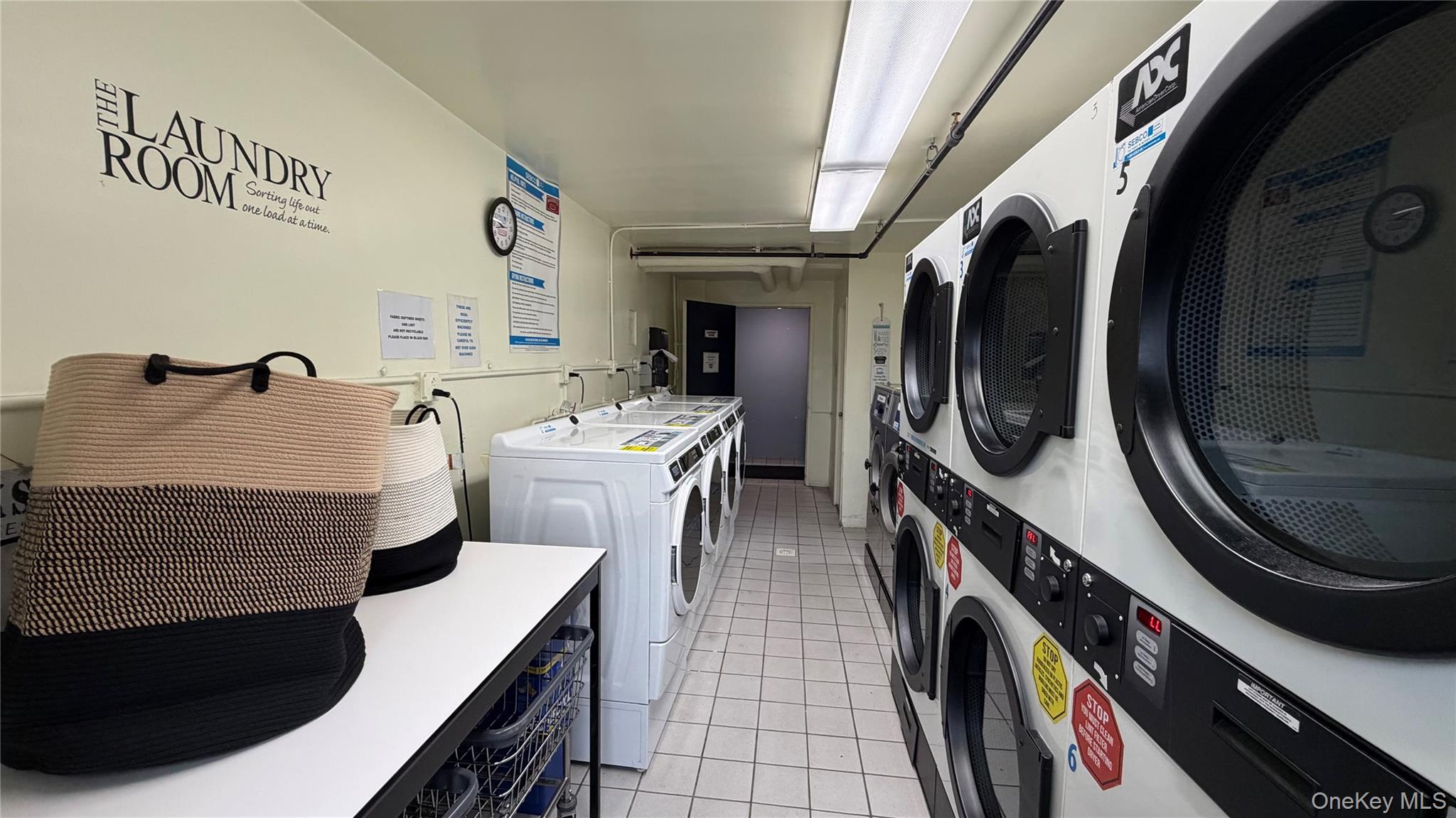 151-05 Cross Island Parkway, Unit 3E Queens, NY 11357 - Photo 23 of 29 a living room with furniture and a fireplace