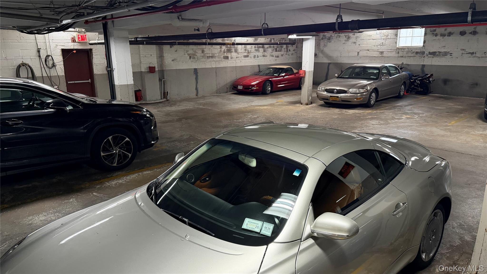 151-05 Cross Island Parkway, Unit 3E Queens, NY 11357 - Photo 29 of 29 a car parked in garage