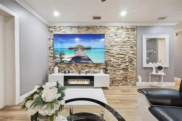 a living room with furniture and a fireplace