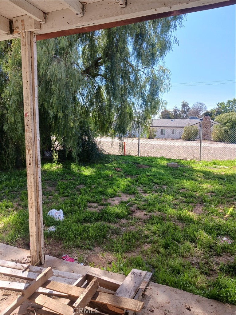 477 County Line Road Calimesa, CA 92320 - Photo 15 of 19 a view of backyard with a garden and trees