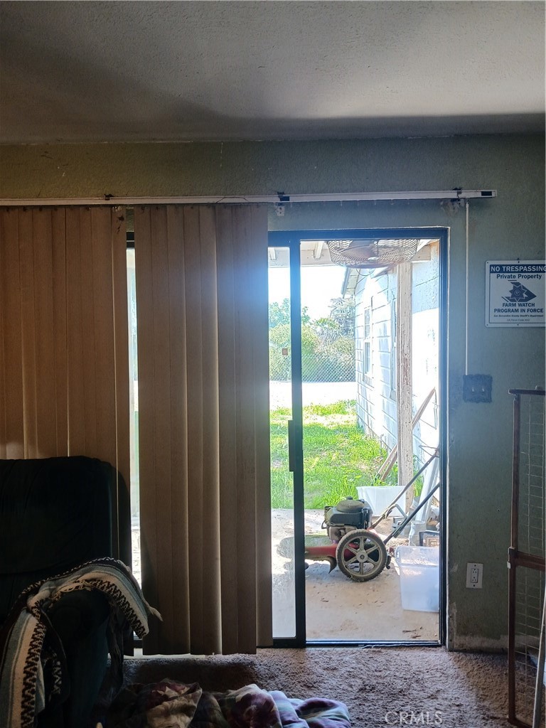 477 County Line Road Calimesa, CA 92320 - Photo 16 of 19 a view of hallway with furniture and a gate