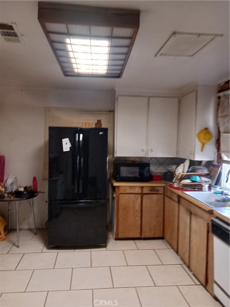 477 County Line Road Calimesa, CA 92320 - Photo 19 of 19 a kitchen with stainless steel appliances granite countertop a sink counter space and cabinets