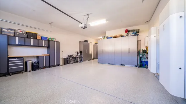 an aerial view of residential houses with city view