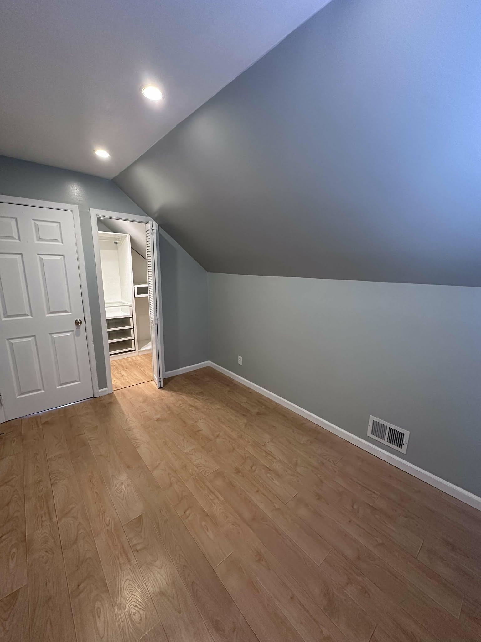 67 Country Village Road, Unit 2 Jersey City, NJ 07305 - Photo 18 of 20 a view of empty room with wooden floor