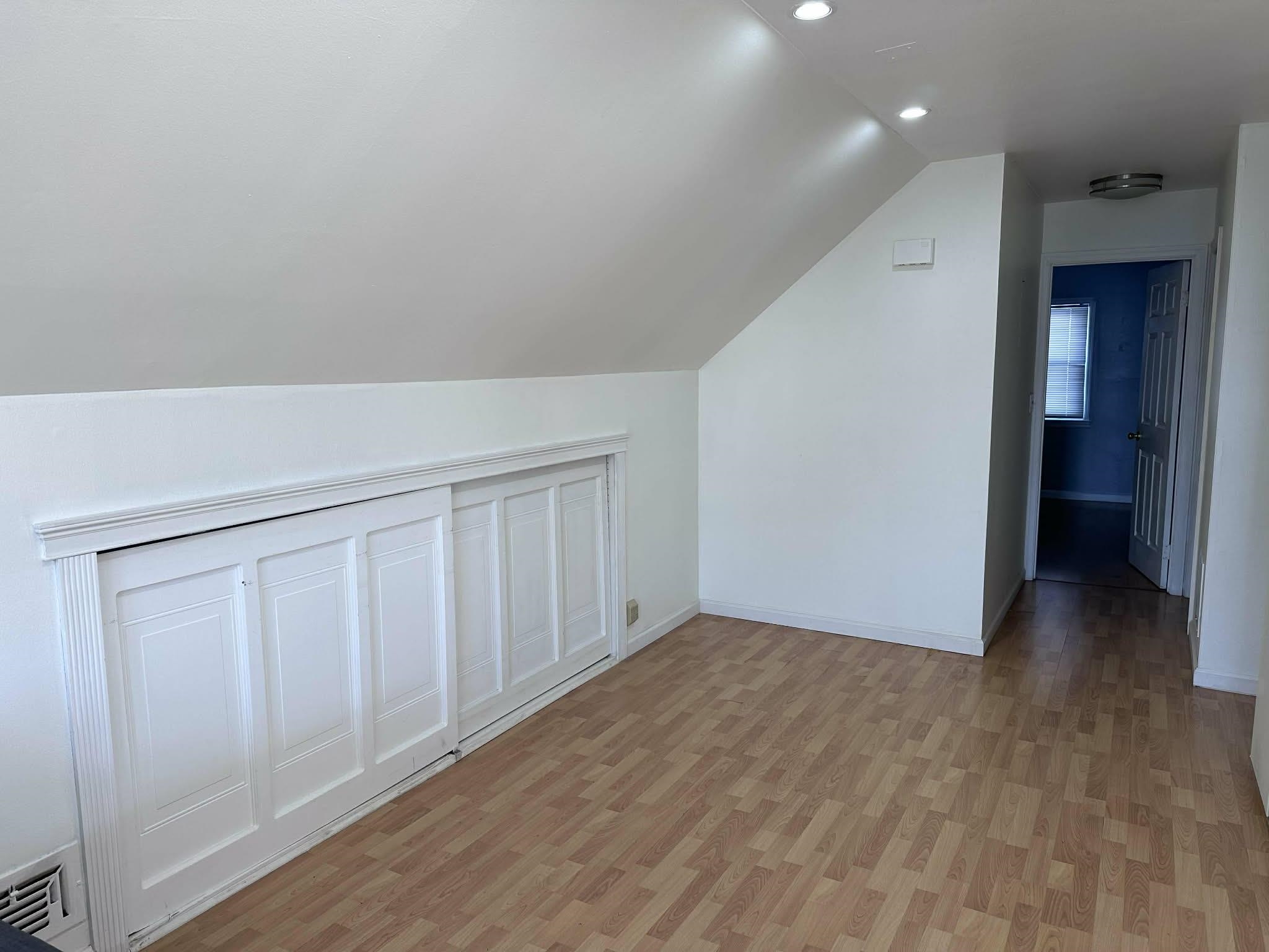 67 Country Village Road, Unit 2 Jersey City, NJ 07305 - Photo 4 of 20 a view of a livingroom with wooden floor
