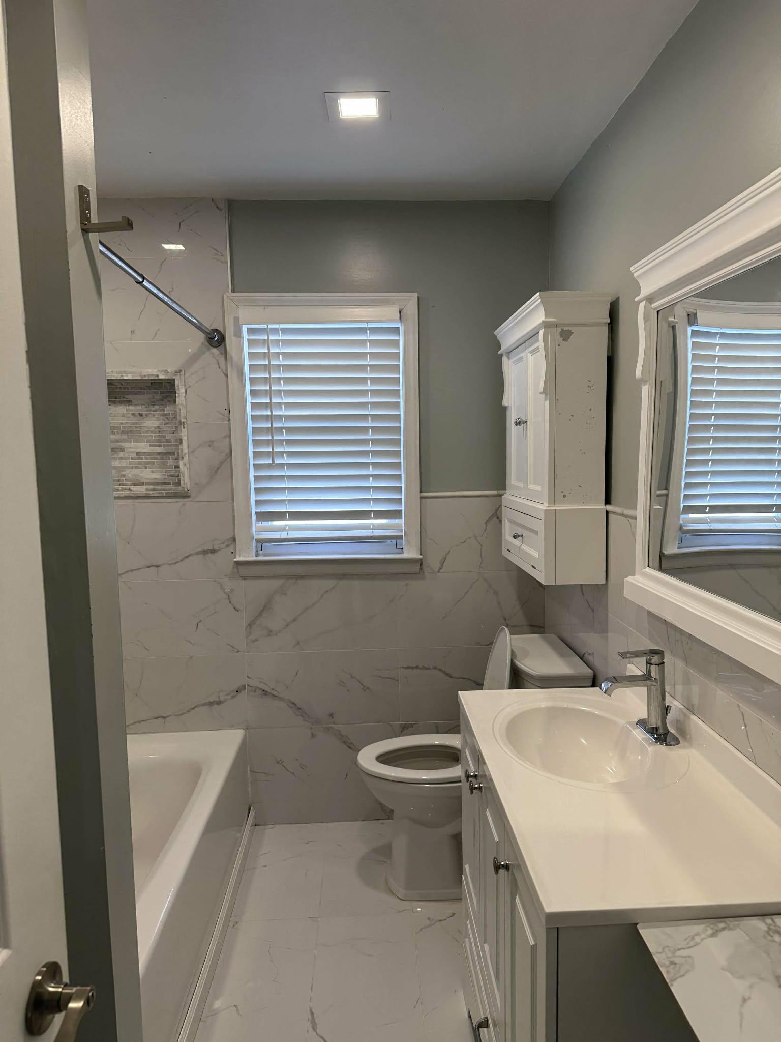 67 Country Village Road, Unit 2 Jersey City, NJ 07305 - Photo 5 of 20 a bathroom with a sink toilet and shower