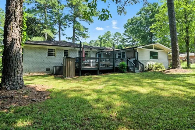 a view of a backyard with a small cabin