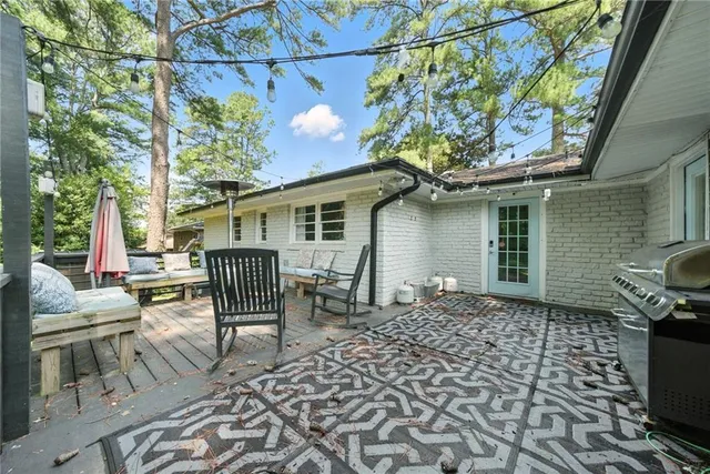 a backyard of a house with yard and outdoor seating