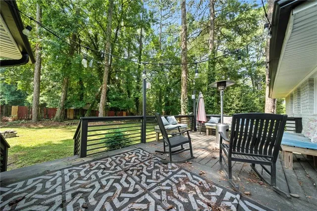 a view of backyard with sitting area