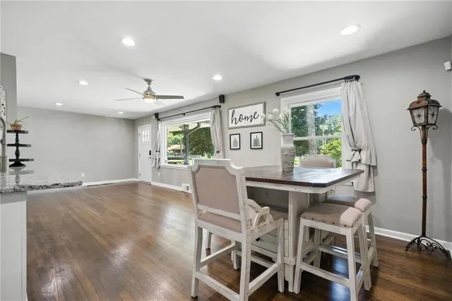 a dining room with furniture and window