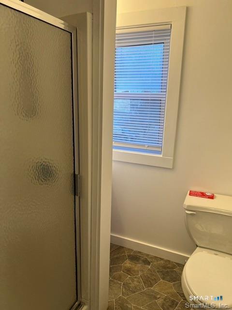 6 Boys Avenue Killingly, CT 06263 - Photo 18 of 20 a white toilet sitting next to a shower curtain