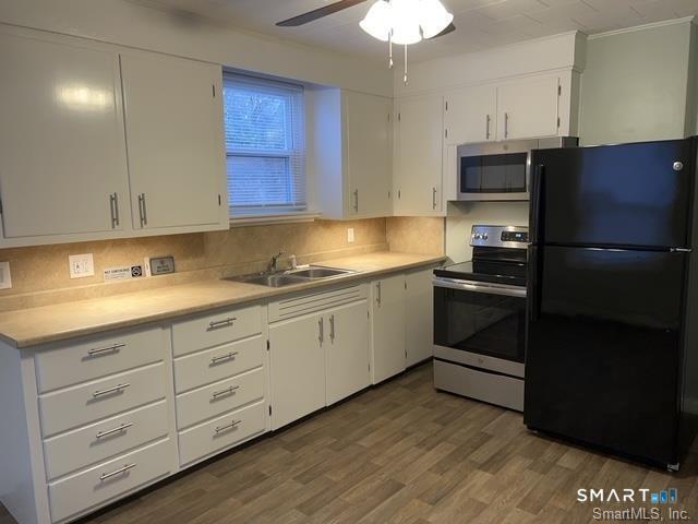 6 Boys Avenue Killingly, CT 06263 - Photo 6 of 20 a kitchen with granite countertop white cabinets and stainless steel appliances