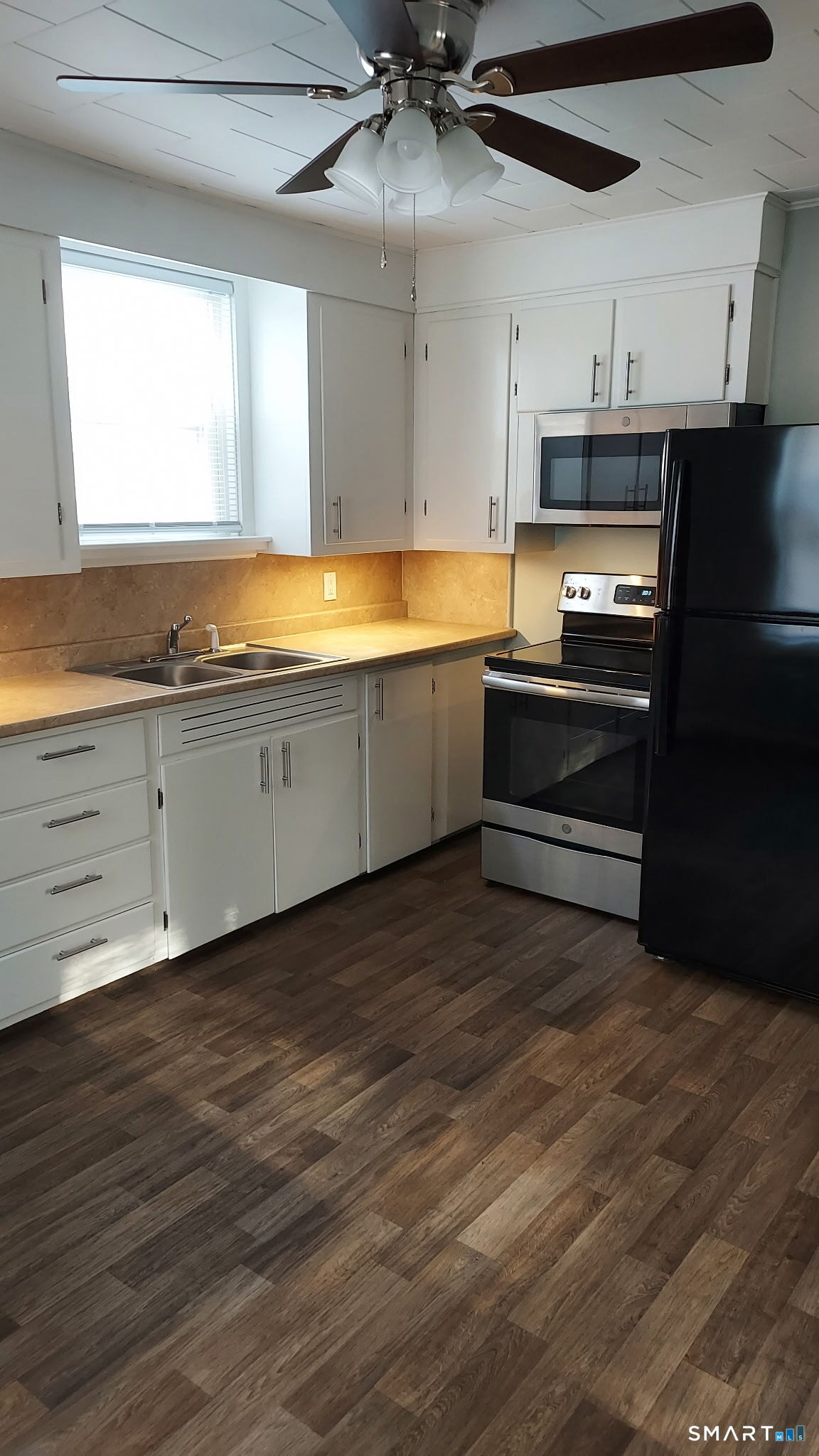 6 Boys Avenue Killingly, CT 06263 - Photo 6 of 7 a large kitchen with cabinets and wooden floor