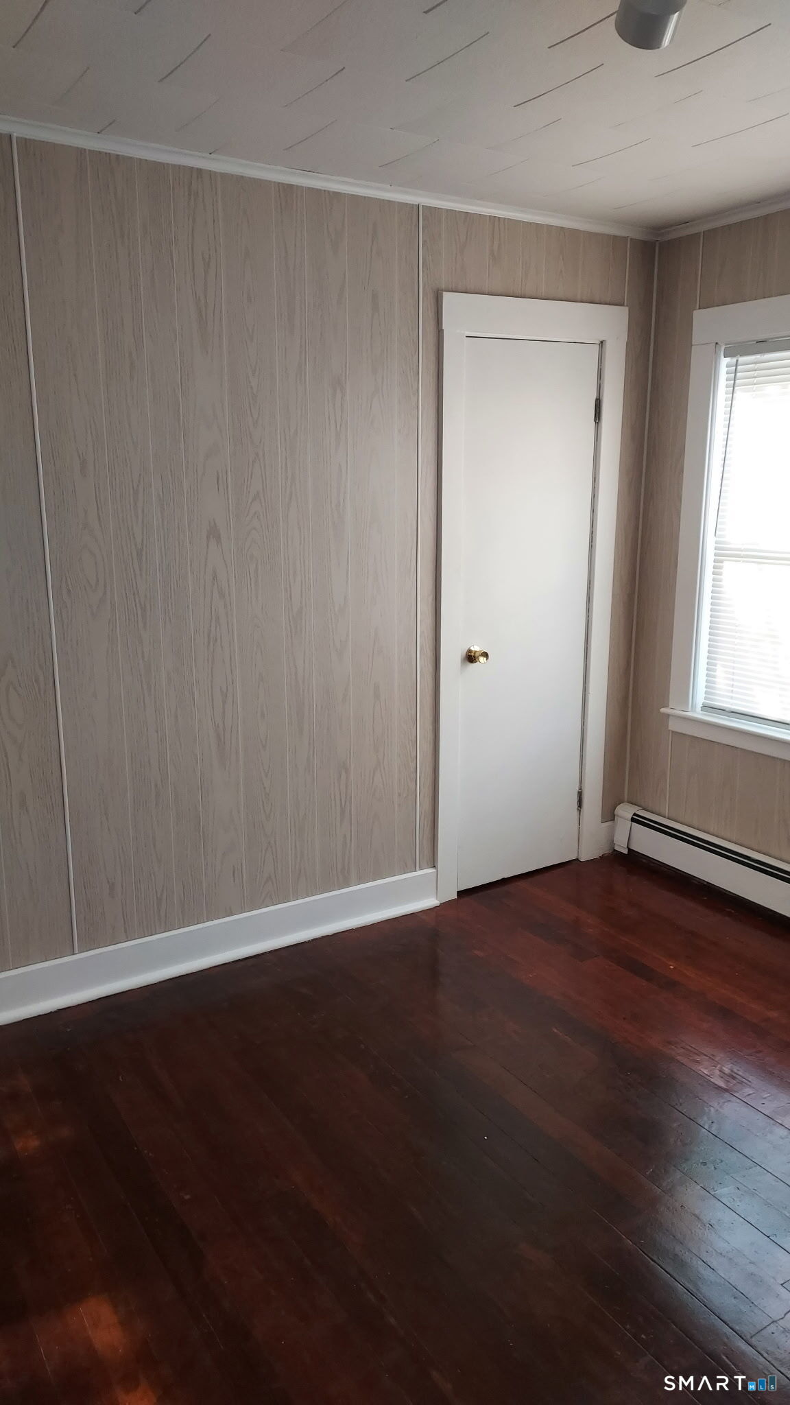 6 Boys Avenue Killingly, CT 06263 - Photo 7 of 7 a view of an empty room with wooden floor and a window