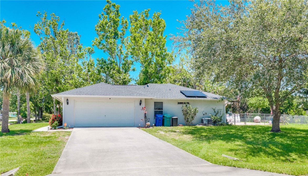 243 Main Street Sebastian, FL 32958 - Photo 1 of 11 a front view of a house with a garden