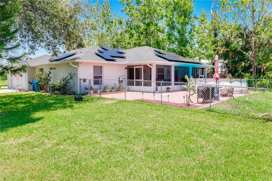 243 Main Street Sebastian, FL 32958 - Photo 4 of 11 a front view of a house with garden