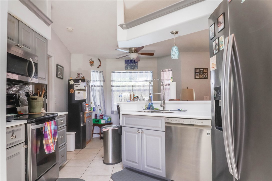 243 Main Street Sebastian, FL 32958 - Photo 5 of 11 a kitchen with a sink and cabinets
