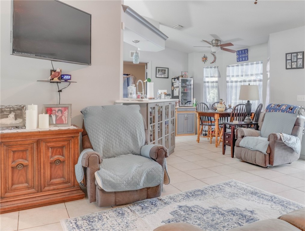 243 Main Street Sebastian, FL 32958 - Photo 8 of 11 a living room with furniture and a flat screen tv