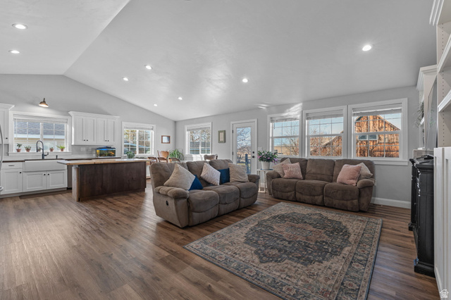 75 North 100th Street West Fillmore, UT 84631 - Photo 8 of 62 Living room with vaulted ceiling, dark wood finished floors, and recessed lighting