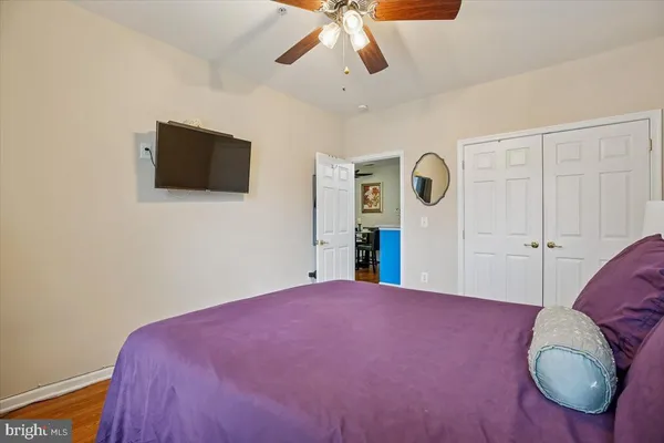a bed room with a bed and a television