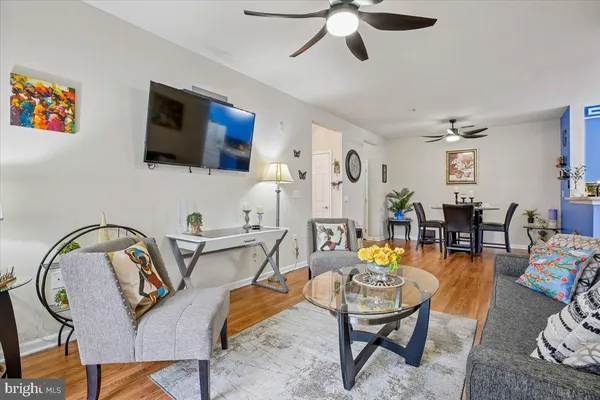a living room with furniture and flat screen tv